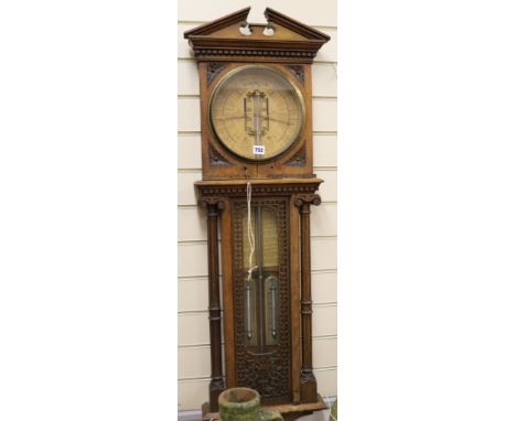 A Joseph Davis & Co Royal Polytechnic barometer, with carved walnut case, H.117cm