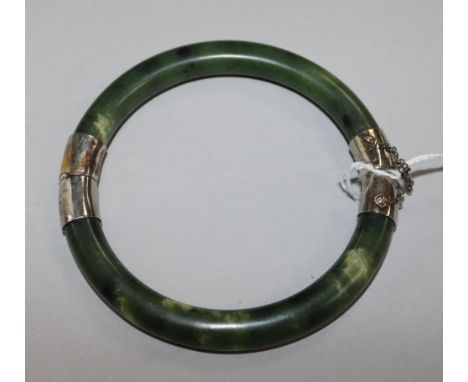 A spinach jade hinged bangle.