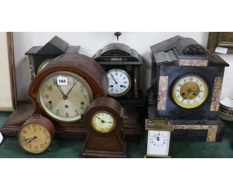 Four French black marble eight day mantel clocks, four other clocks and an aneroid barometer (8)