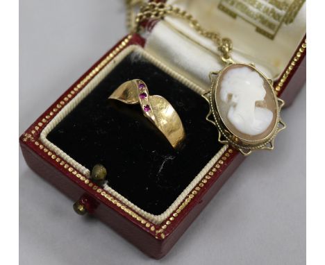 A 9ct gold mounted cameo on 9ct chain, a yellow metal ring and a Cartier box.