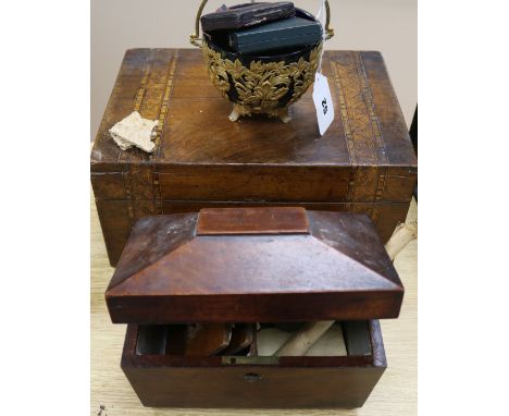 A collection of medallions, caddy writing slope and a gilt and glass basket