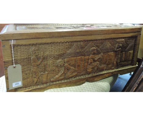 A West African hardwood trunk carved with numerous native figures and animals W 88 cms
