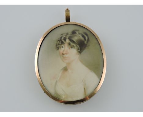 An early 19th century oval portrait miniature of an elegant lady, wearing a white empire line dress with her hair up and arra