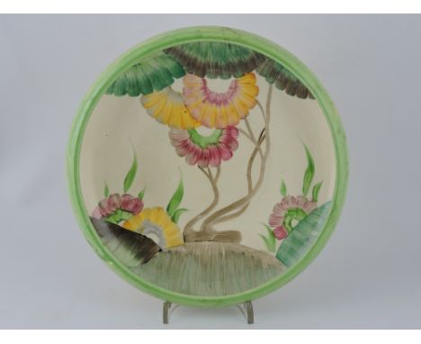 A Clarice Cliff Aurea pattern Bizarre ware bowl, circular with a folded rim, D. 25cm.
