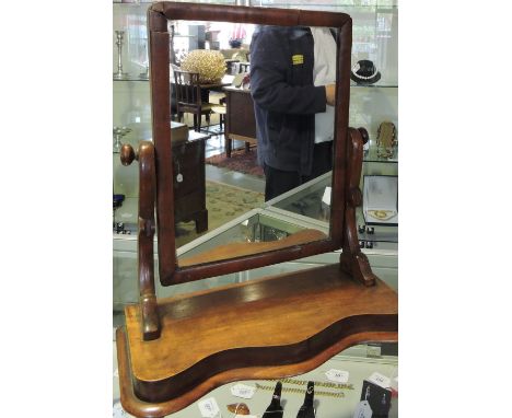 A Victorian mahogany toilet mirror with serpentine plinth base H 54 cms.