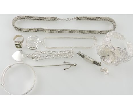 A quantity of white metal jewellery including a bracelet with heart shaped pendant, stick pin incorporating a spur, pendant, 