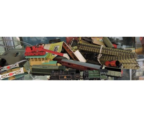 A quantity of Hornby Dublo trains, carriages and accessories including an 0 4 0 tank engine, a diesel locomotive, goods wagon