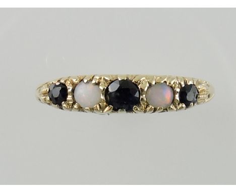 A sapphire and opal dress ring, set in a 9ct gold band, 1.5g.