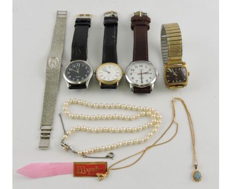 A gentleman's Timex wristwatch, the white dial with Arabic numerals day and date aperture, together with four other wristwatc