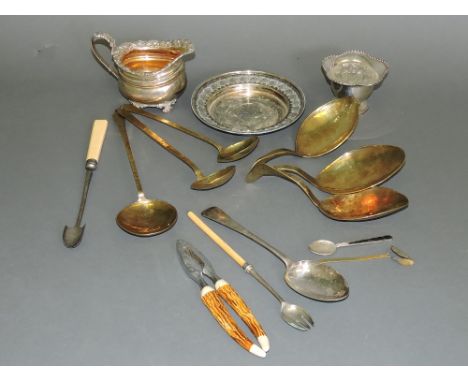 A quantity of 19th and 20th century silver plated and metal ware, including an entree dish, toast rack and a chamber stick, (