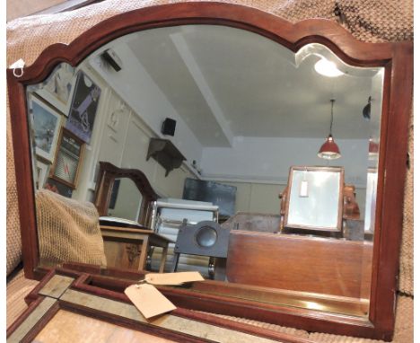 An Edwardian bevelled wall mirror formerly from a dressing table