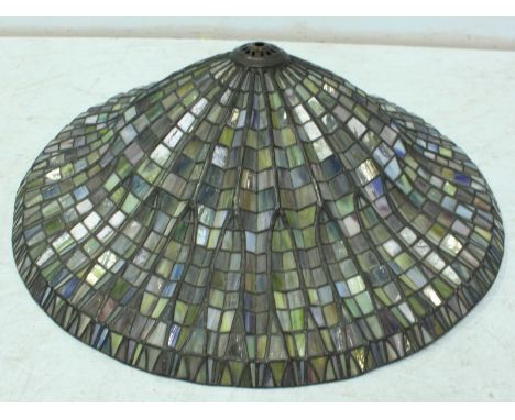 A Meyda Tiffany leaded glass light shade, decorated with multi-coloured radiating leaves. 61 cm diameter.