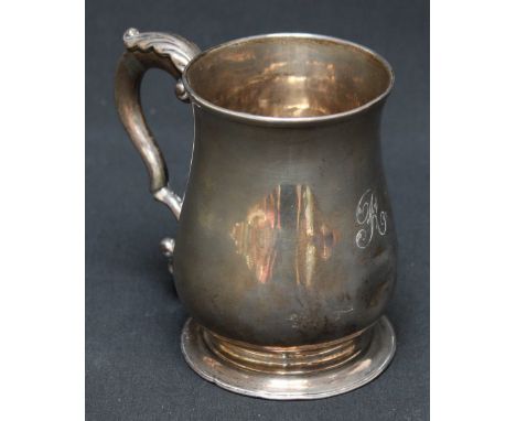 A George III silver tankard, hallmarked London 1778, of baluster form with acanthus capped scrolled handle and engraved initi