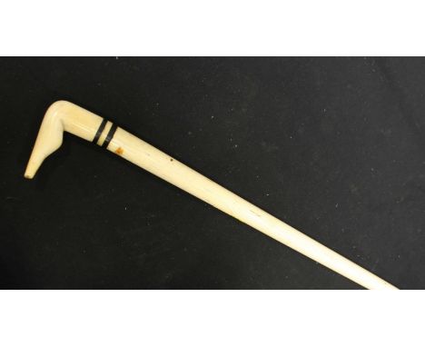 A 19th century whale bone walking stick with carved ivory handle in the form of a leg, (handle AF). 85.25 cm long.