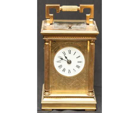 A 20th century Charles Frodsham brass repeating carriage clock, with white enamel and black Roman numerals, engraved face pla