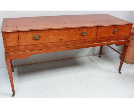A George III mahogany spinet case, converted to a desk, the sectioned part rising top over drawers with oval brass handles an