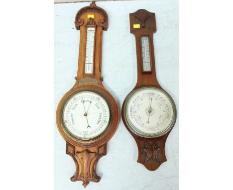 Two early 20th Century aneroid banjo barometers, one walnut with silvered dial barometer and thermometer, the other oak with 