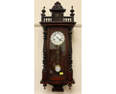 A late 19th/early 20th Century Vienna style wall clock with white enamel dial, Roman numerals denoting hours and compensation
