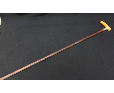 A silver and ivory handled partridge wood walking stick.