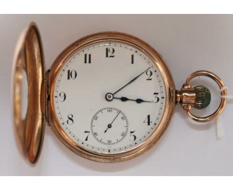 A 9ct gold half hunter pocket watch with white enamel dial and Arabic numerals with subsidiary seconds dial, 83.9 grams.