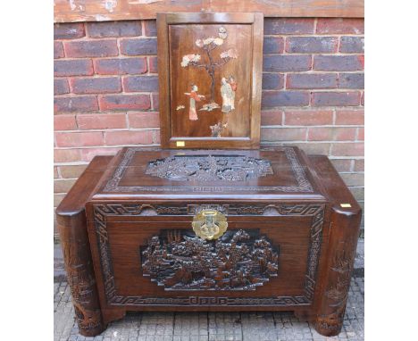 A 20th century oriental stained camphor wood blanket box, in the Odeon style, with figural-carved top, 100cm wide, together a