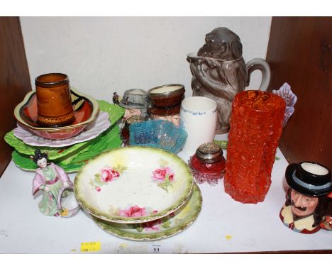 SECTION 11. A shelf of assorted ceramics and glassware including a Whitefriars tangerine glass bark vase, Beswick leaf dishes