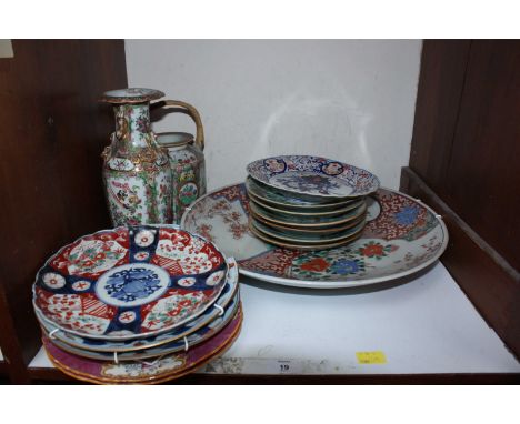 SECTION 19. A collection of Oriental ceramics including a set of Chinese famille rose plates, Canton enamel teapot and vase, 