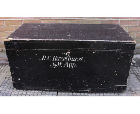 A black-painted pine tool chest of rectangular form with hinged cover.  