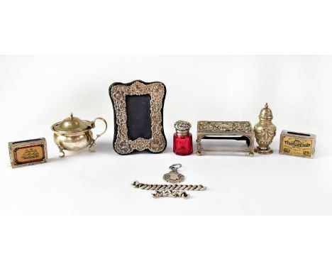 A group of hallmarked silver items, comprising a large matchbox cover with floral decoration and vacant cartouche to top, Wal