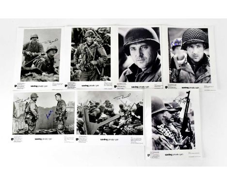 SAVING PRIVATE RYAN; seven black and white promotional photographs, bearing signatures of Steven Spielberg, Tom Sizemore, Edw