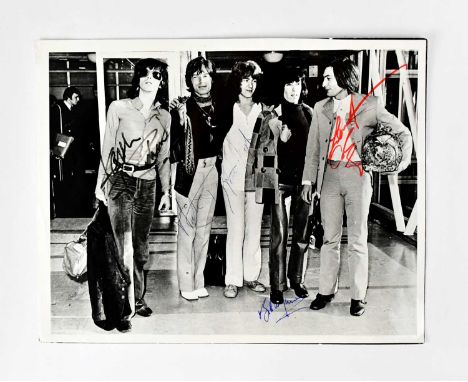 THE ROLLING STONES; a black and white promotional photograph, bearing signatures to include Mick Jagger, Bill Wyman, Charlie 