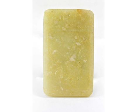 A Chinese jade tablet/pendant of rectangular form in celadon and russet colours, one side carved with figures in a landscape 