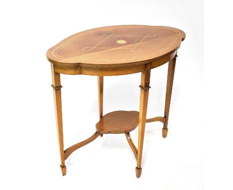 An early 20th century mahogany occasional centre table of lobed form with inlaid top decoration, with tapered supports and mi