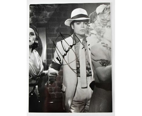 MICHAEL JACKSON; a black and white signed photograph, 20 x 15cm.Condition Report: We have not authenticated these signatures,