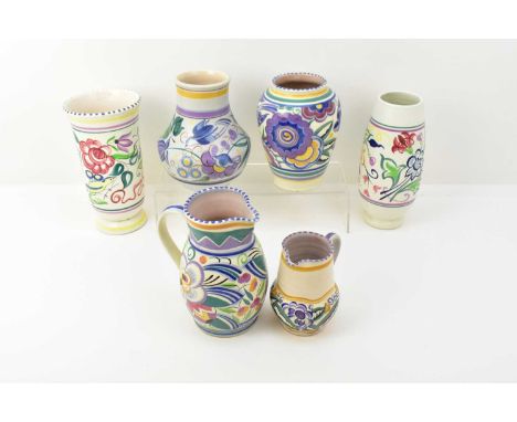 POOLE POTTERY; six items comprising two jugs, height of tallest 18cm, height of smallest 12.5cm, and an ovoid form vase by Tr