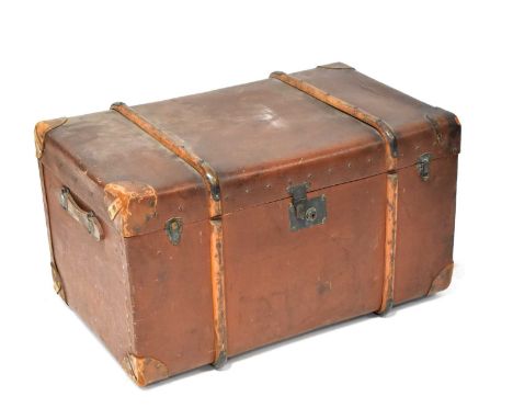 A large leather covered wooden bound travelling trunk with studs and metal locks, 46 x 85 x 50cm.