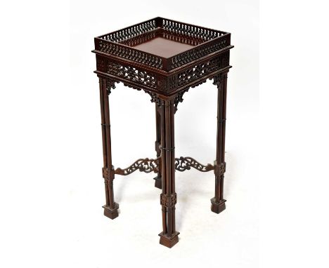 A Chippendale-style mahogany square-topped occasional table, with pierced fretwork gallery and apron with one pull-out rest, 