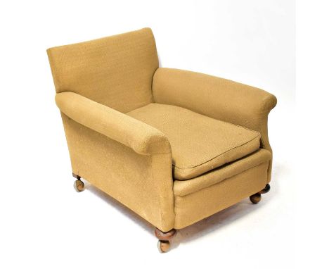 A late 19th century deep low armchair in the Howard style, numbered '84' to the inside back leg, overall height 73cm, height 