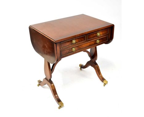 A reproduction mahogany crossbanded and line inlaid sofa table of small proportions with two short and one long drawer, raise