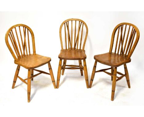 Three elm hoop and stick back dining chairs on turned legs, together with a small footstool with cabriole legs and tapestry t