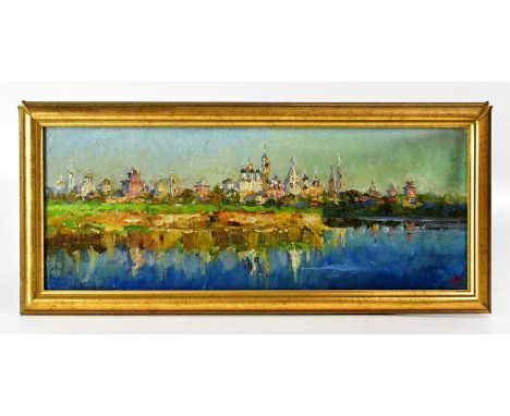 IVAN KOMOROVSKY (Russian, 1960-2010); oil on canvas, view of Kolomna from the Moskva river, signed lower right, 20.5 x 53.5cm