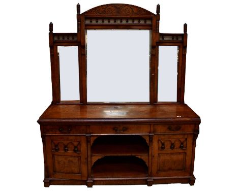 An Edwardian walnut mirror back sideboard, with triple mirror over bobbin turned detail, above a base of three drawers and a 
