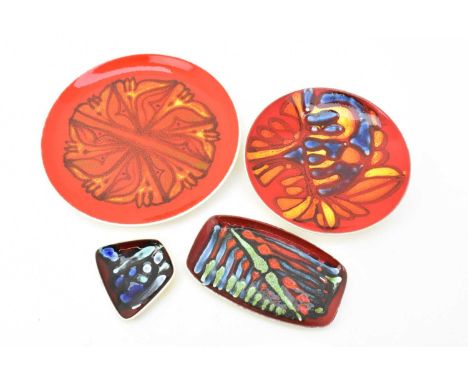 POOLE POTTERY; four 1970s 'Delphis' range items, comprising a large plate, with decorator's mark attributed to Julia Wills, d