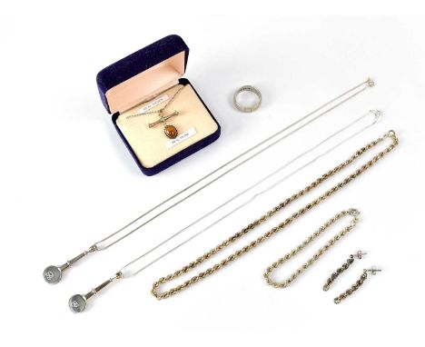 A matching set of necklace, bracelet and a pair of drop earrings in the form of twisted chains, together with two pendants on