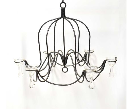 A contemporary six-branch chandelier, each branch with a drop-in glass candleholder, with bob weight, height of fitting 55cm,