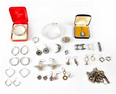 A group of hallmarked silver items, comprising a child's bangle, a bangle with bright cut decoration, a pair of cufflinks, a 