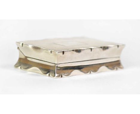 E. J. TREVITT &amp; SONS; a George V hallmarked silver snuffbox of shaped rectangular waisted form, with engine turned decora