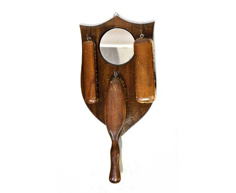 An early 20th century oak banjo barometer with carved leaf detail and attached thermometer, a square wall mirror with bevelle
