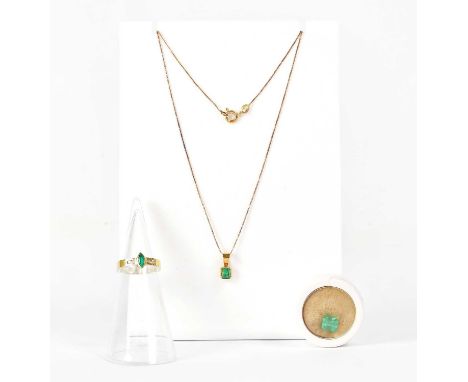 An 18ct gold pendant set with an emerald, stamped '18k', on a fine 18ct gold chain link necklace stamped '750', approx. 1.9g,
