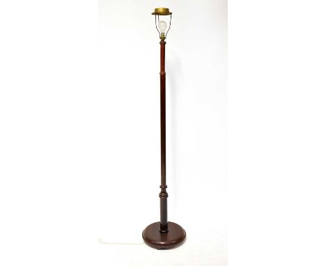 A mid-20th century mahogany standard lamp with turned column on a circular base, height 151cm.Condition Report: - Please note
